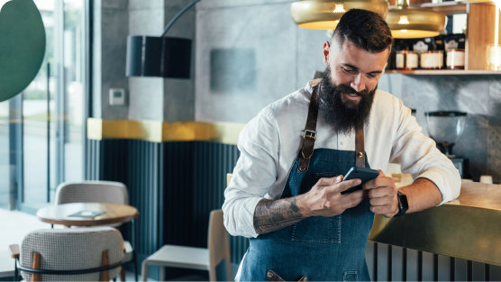 Café owner using EE Mobile Manager in his café.