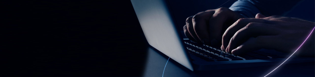 man typing on keyboard