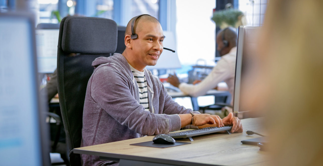 Mature man working in call centre