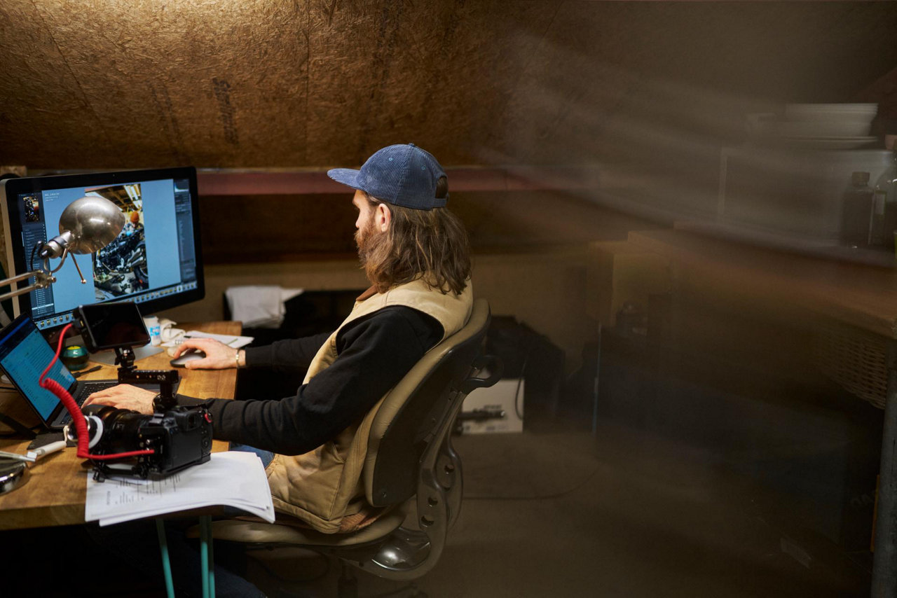 motorcycle shop owner on computer