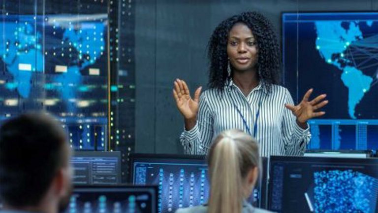 woman speaking to colleagues