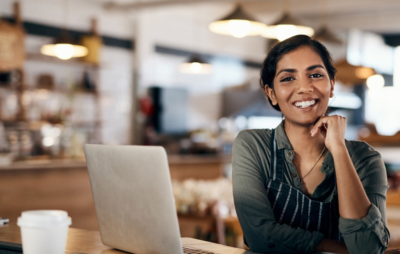 An empowered business owner at their laptop