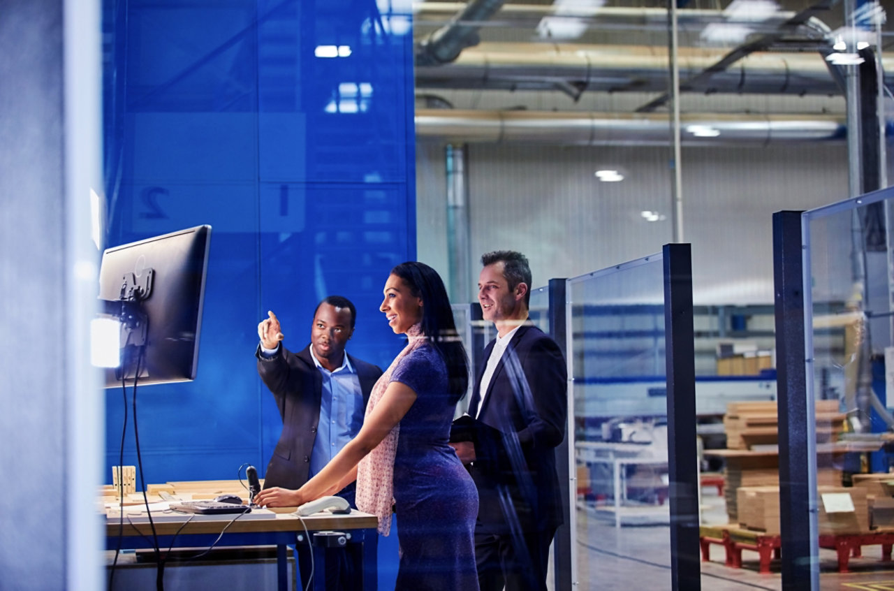 people talking in a factory