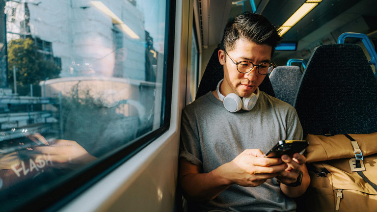 man holding phone on farm