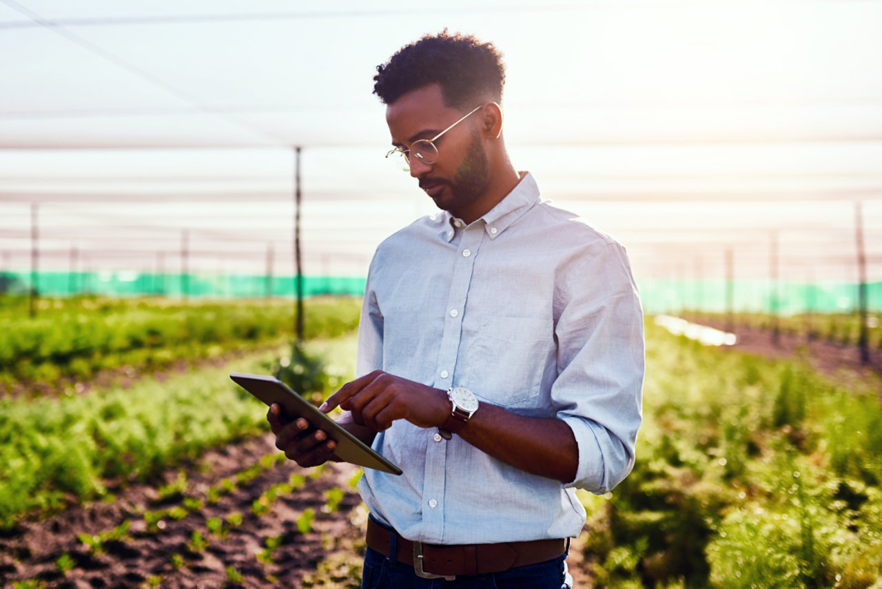 person in field using tablet on a data-only plan