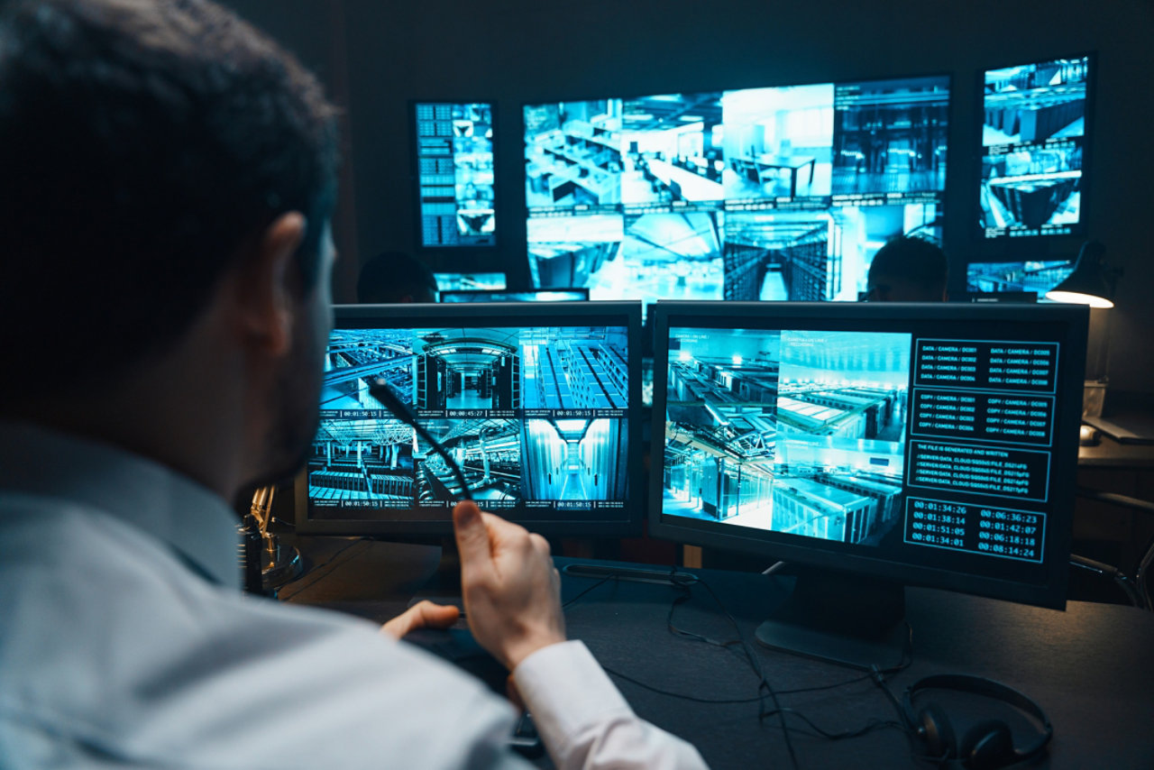 Police officers at surveillance control centre