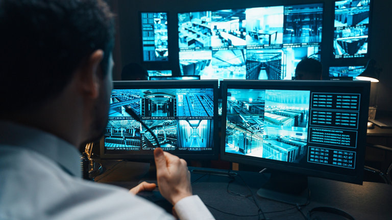 Police officers at surveillance control centre