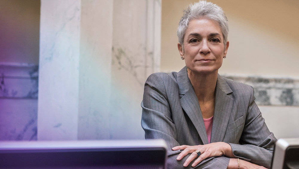 woman in suit looking at camera