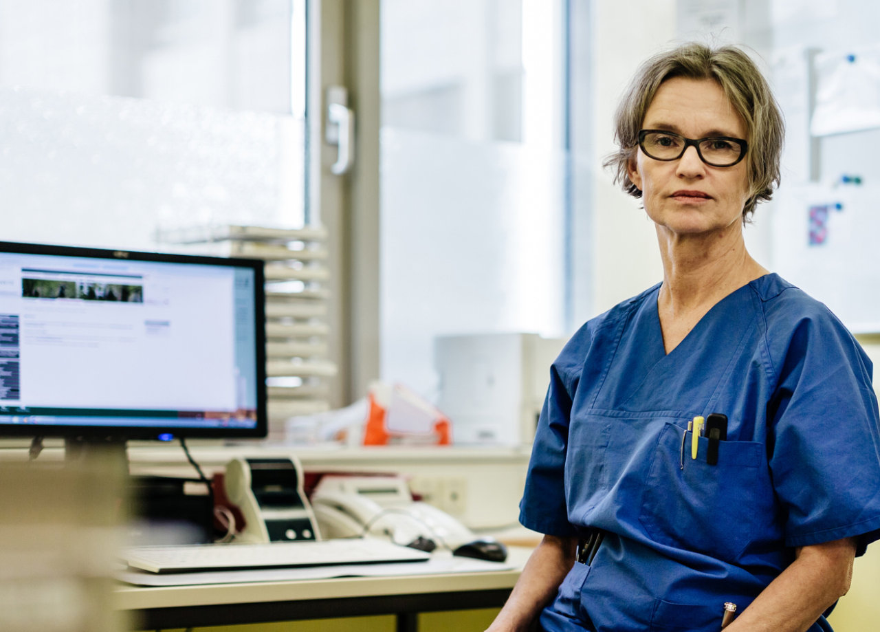 Portrait of female mature doctor sitting