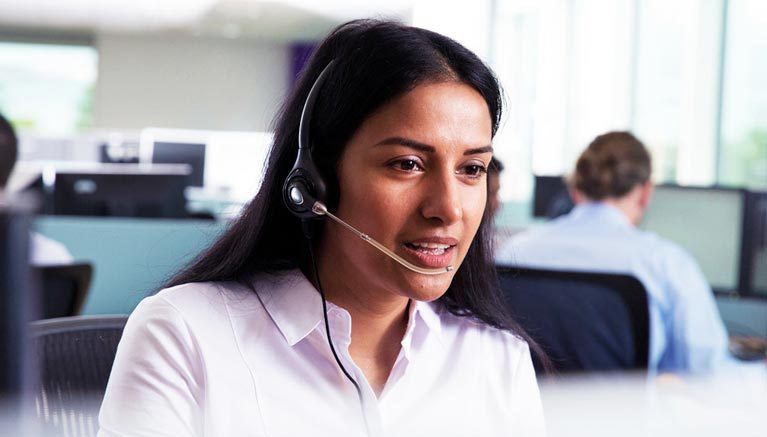 Woman in office on phone call
