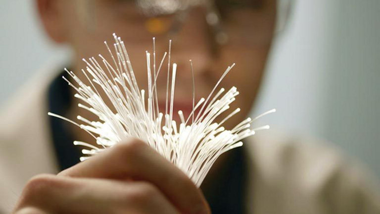 man holding fibre optic cables
