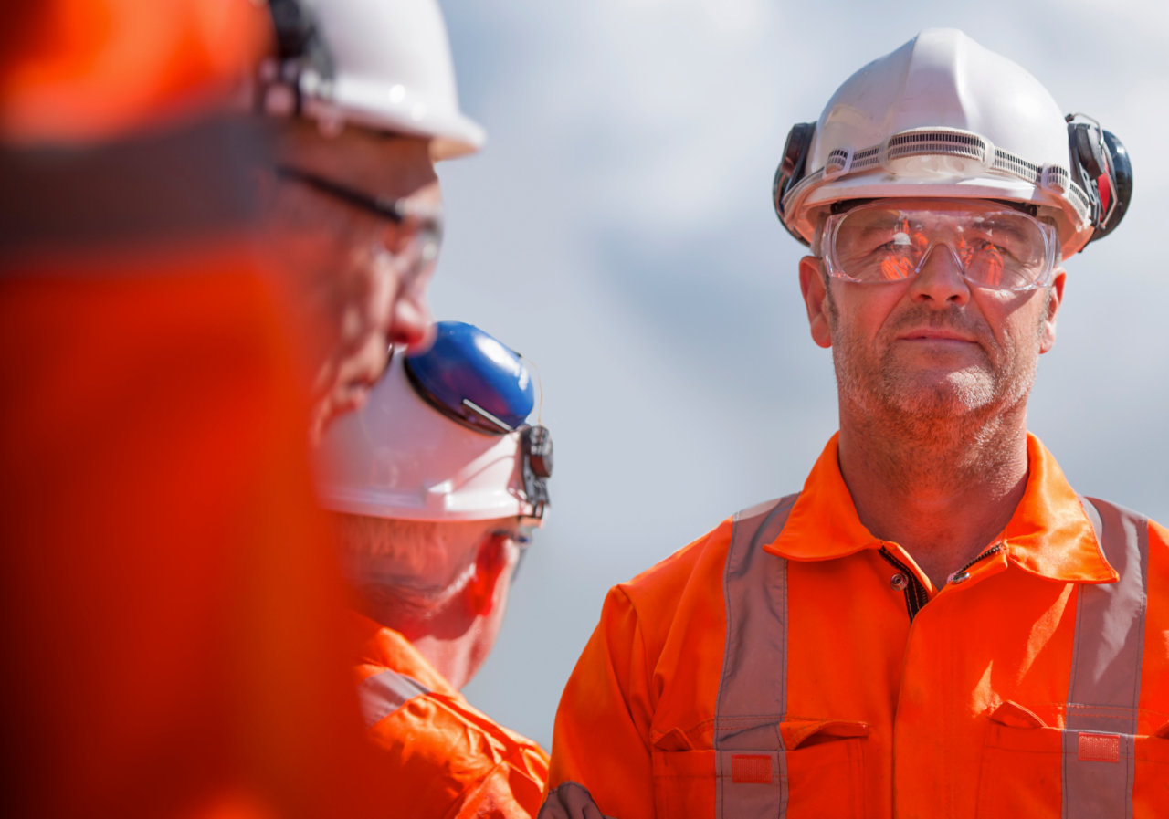 railway worker with colleagues 