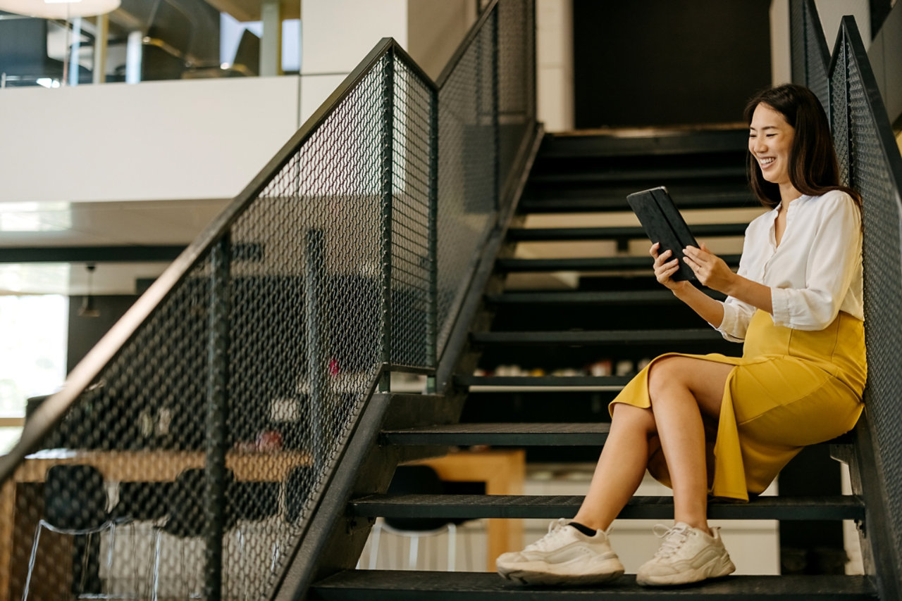 relaxed work on tablet in office setting