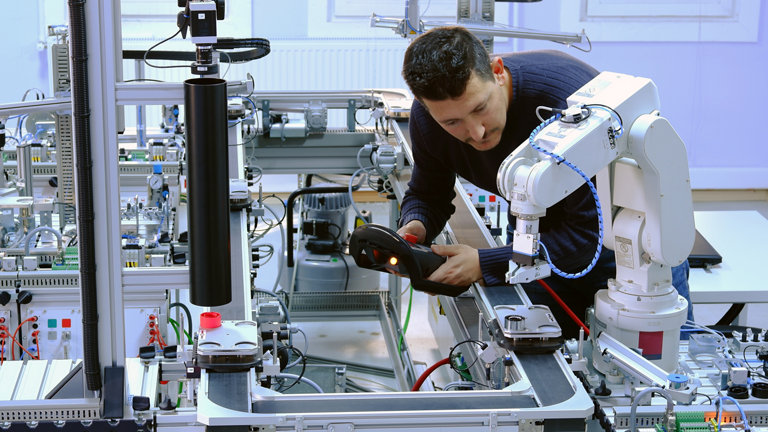 technician using a robotic arm