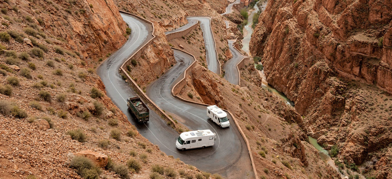 RV's driving up steep cliff