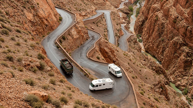 RV's driving up steep cliff