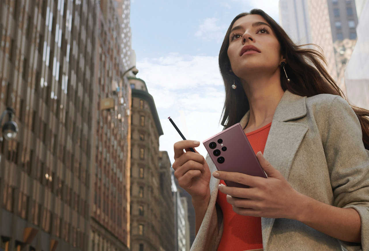 Shot of young businesswoman holding a phone