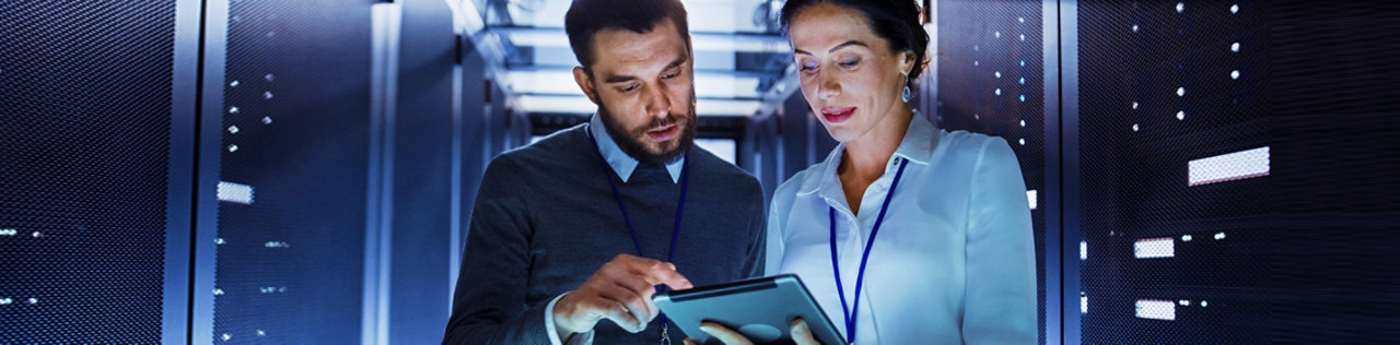 employees in a data centre looking at information