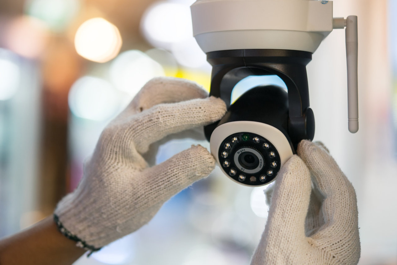 guard working on a CCTV camera