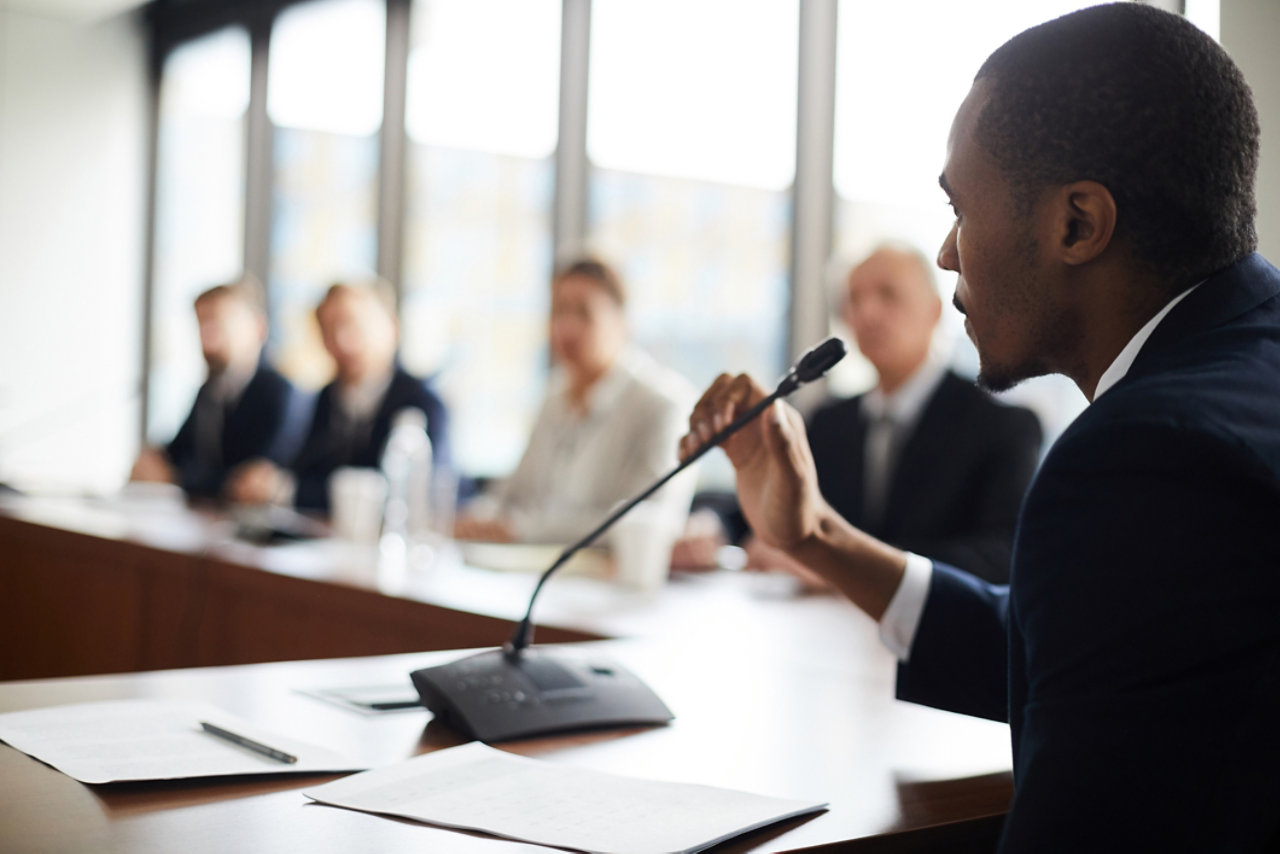 businessman sitting at conference table