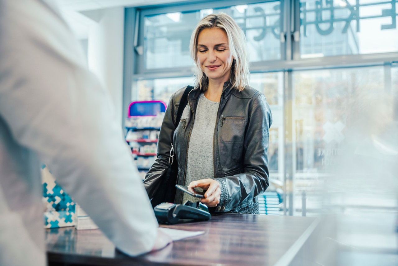customer making payment through mobile device