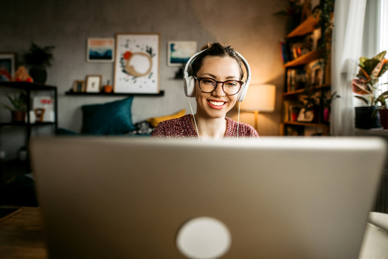 Smiling young woman teaching online