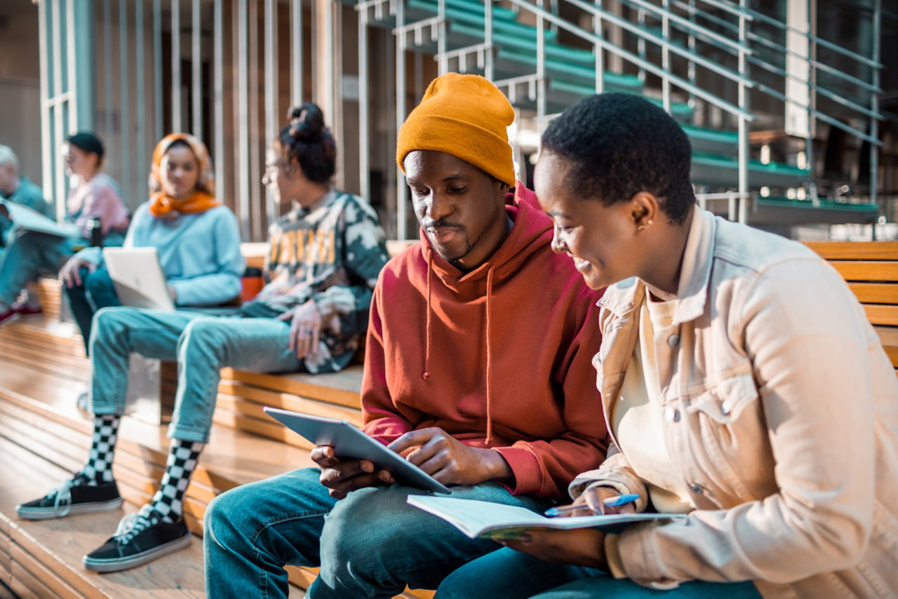 Students socialising in the lobby of the university