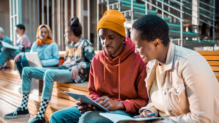 Students socialising in the lobby of the university