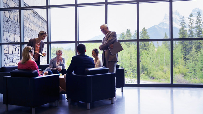 team discussing in lounge area