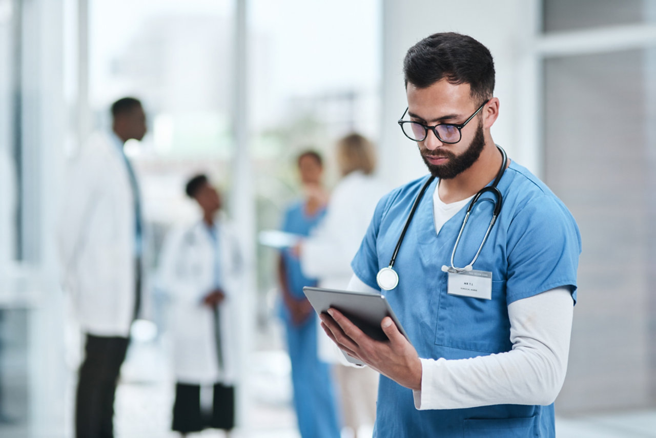 Doctor using tablet computer