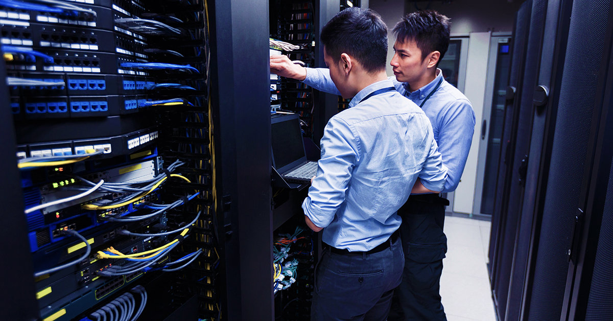 Two men working with office cables