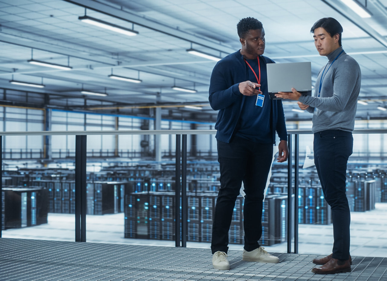 Two colleagues talking in a data centre