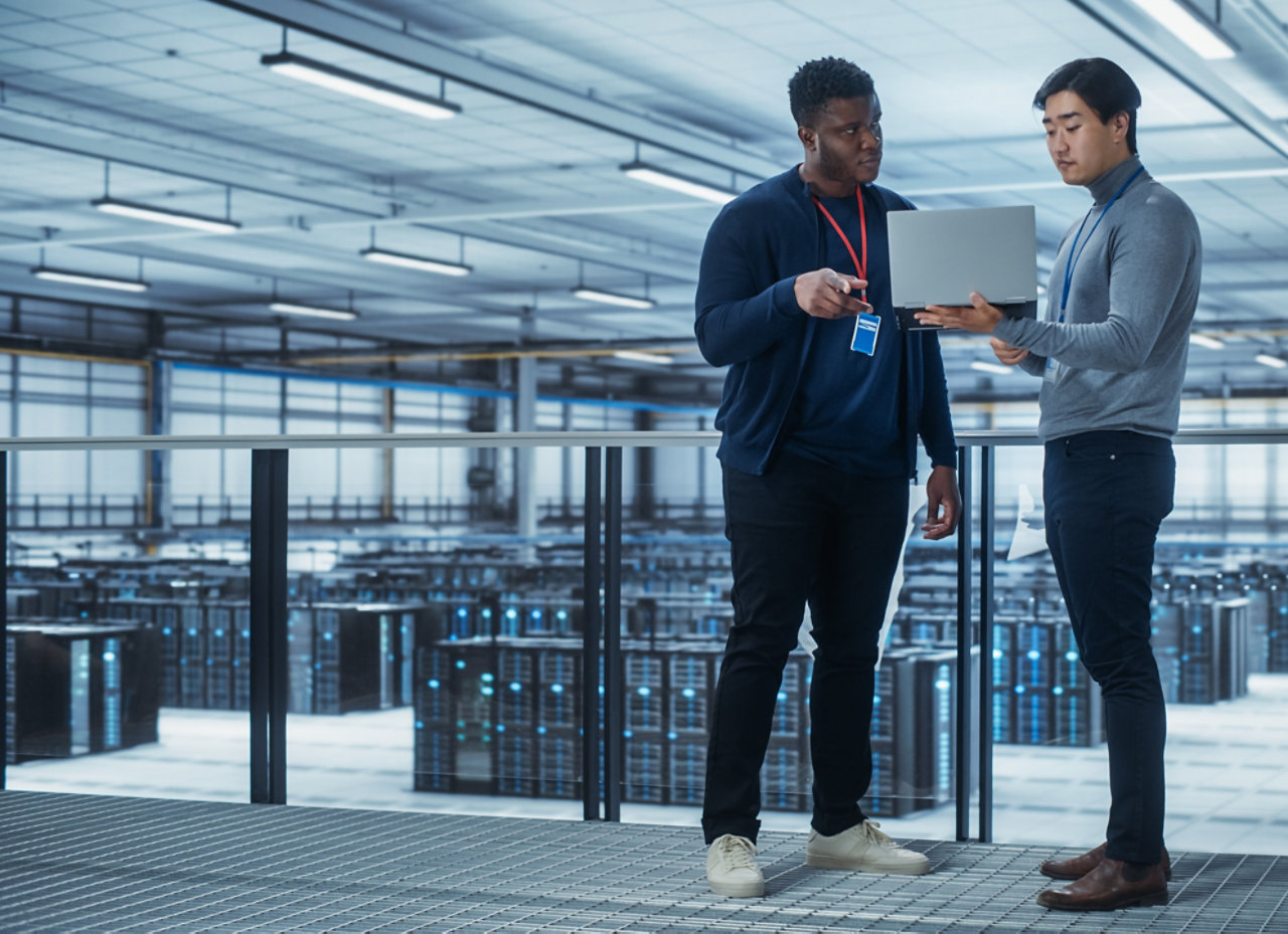 Two colleagues in server room