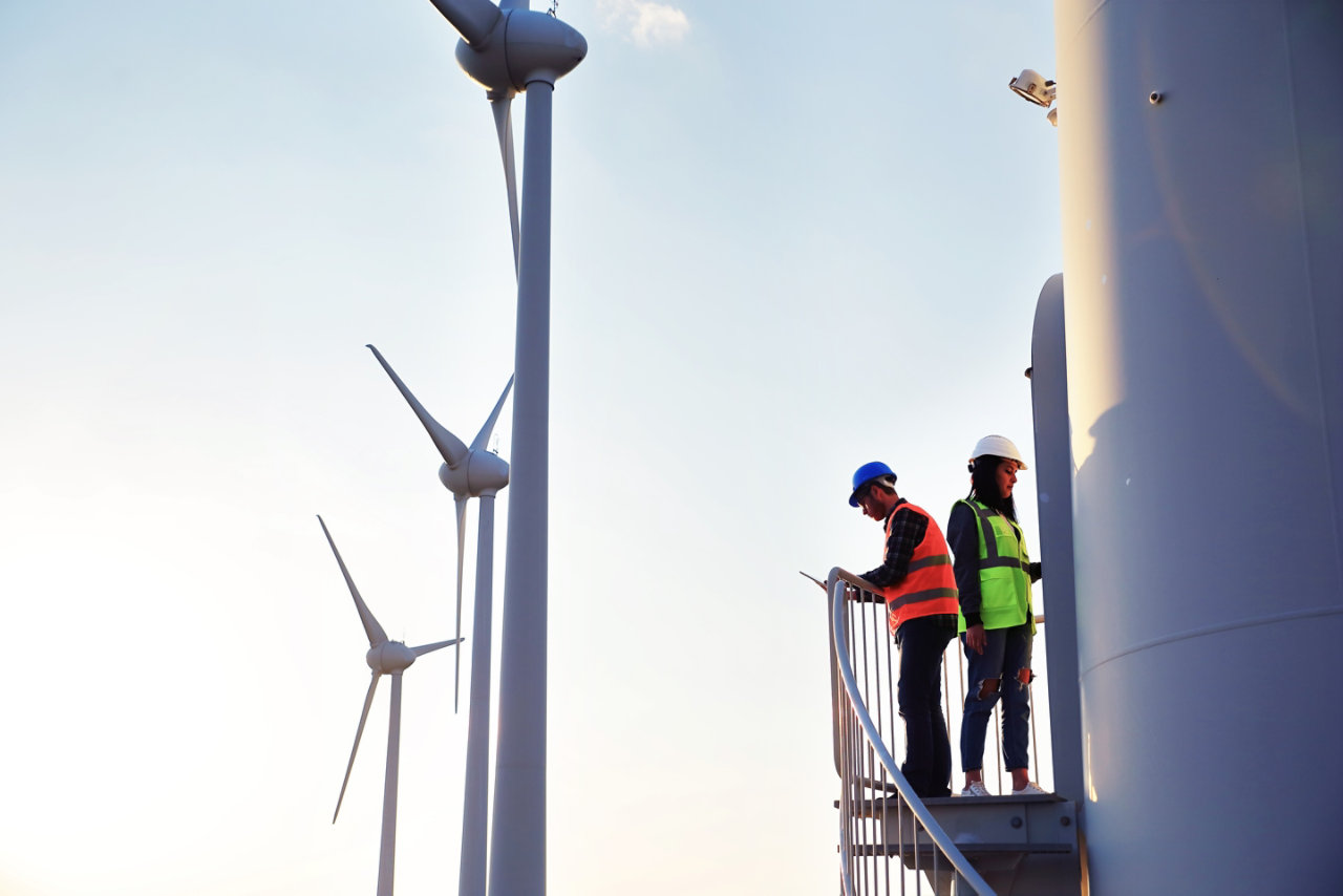 Two workers on a wind turbine