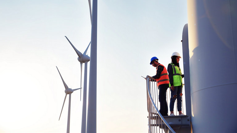 Two workers on a wind turbine