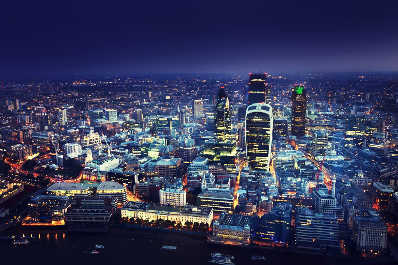 view of a city at night from the air