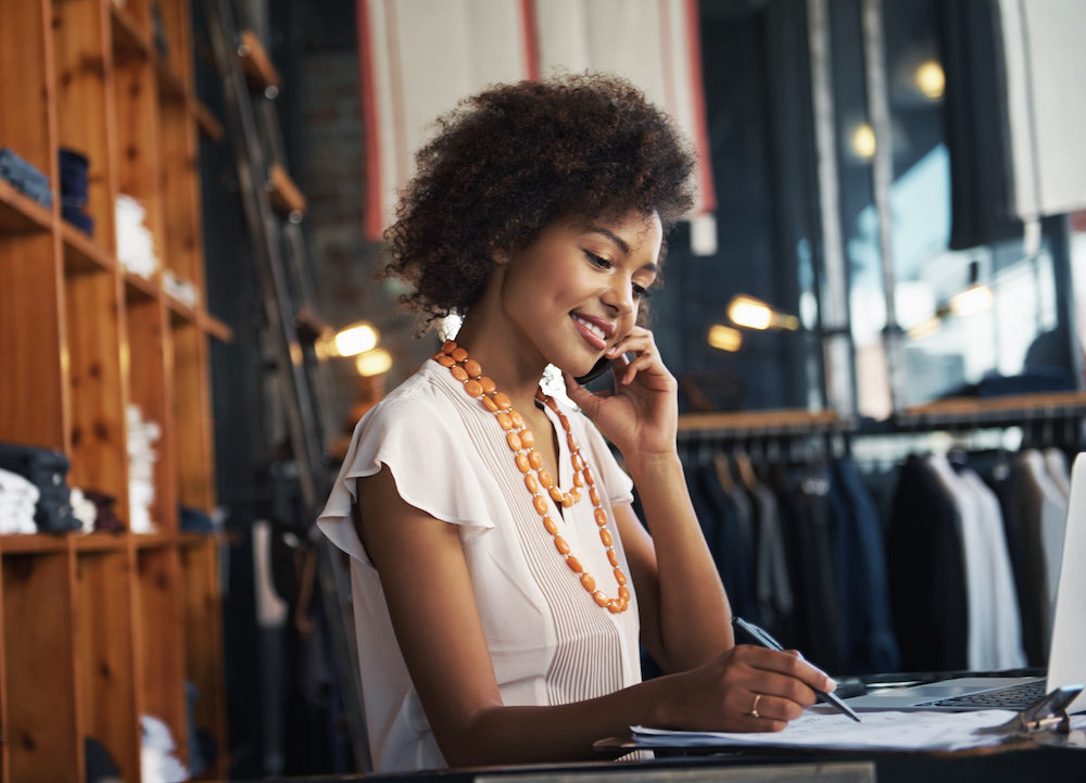 woman in retail using phone