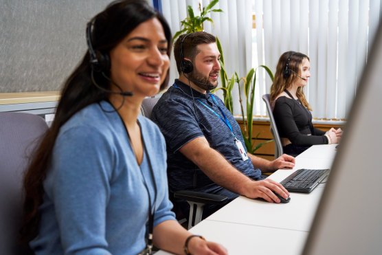 Woman using headset to make phone call