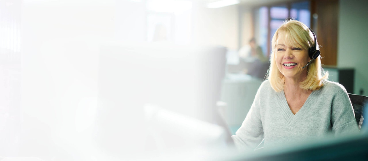 Woman with headset working in customer service