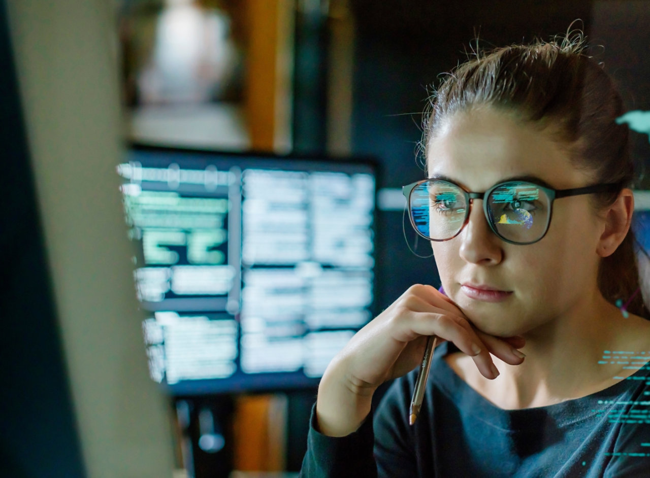 Young woman working in communications room